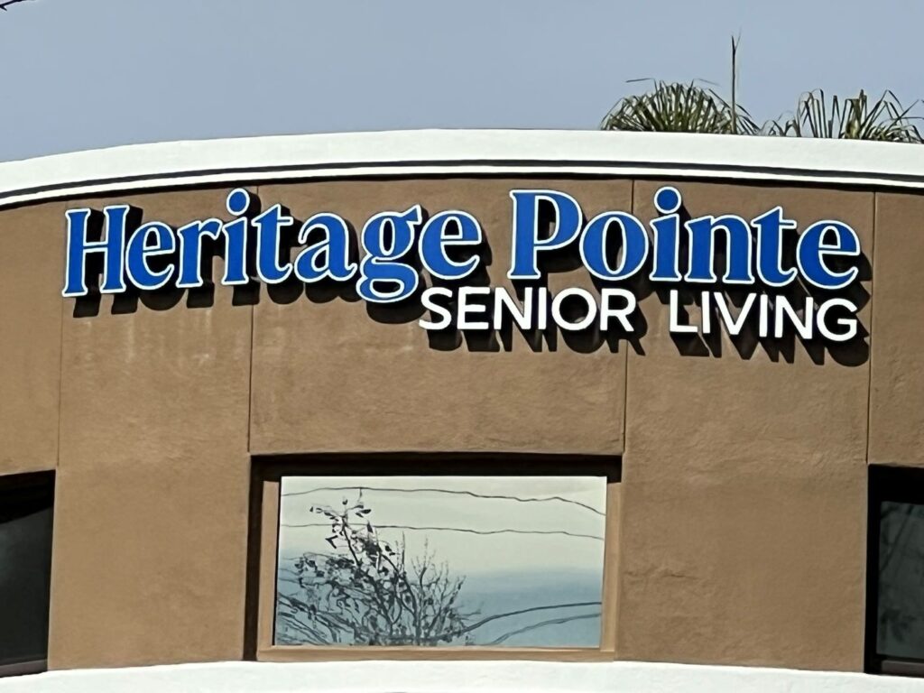 Close-up dimensional letter facade sign with layered raised letters in CA.